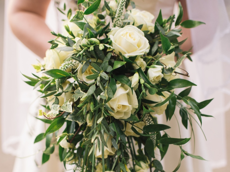 Bride holding a beautiful flower bouquet